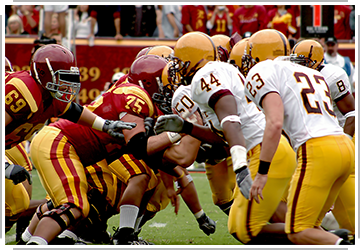 two football teams colliding