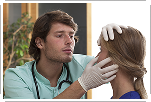 doctor examines young girl’s eyes