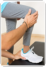 close-up legs as therapist helps patient use steps