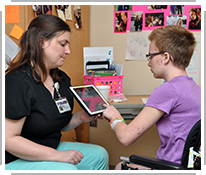 speech therapist working with boy