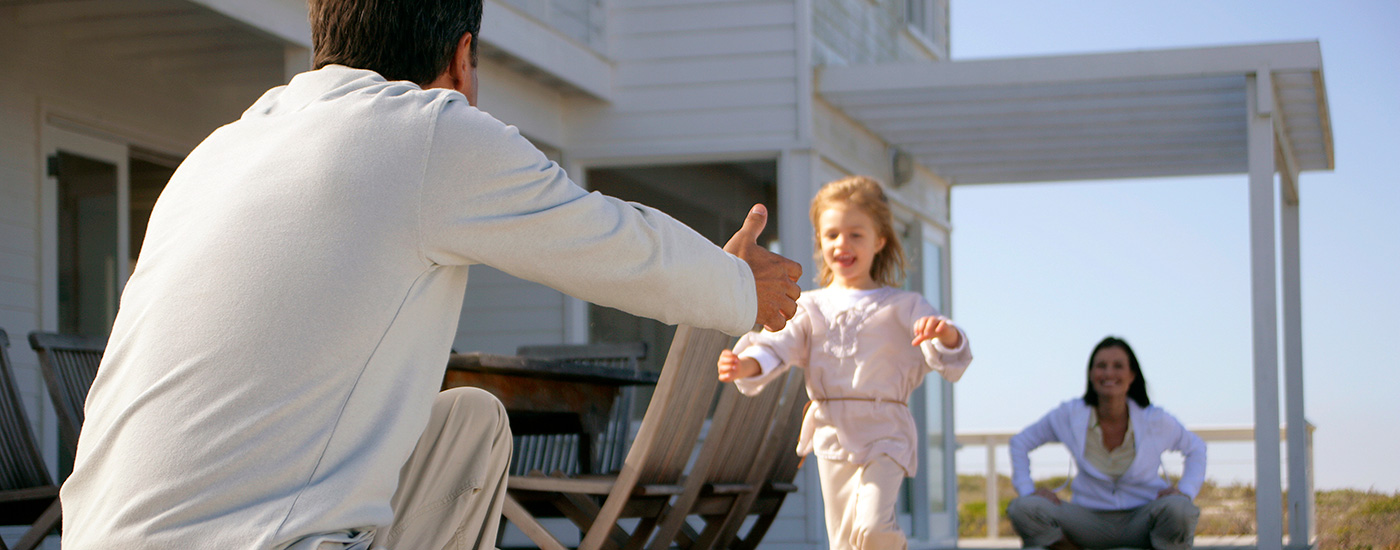 Child running to her father's open arms.