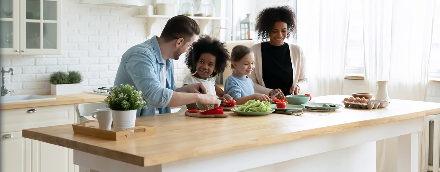 Happy family preparing a meal.