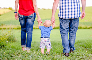 Child walking with parents